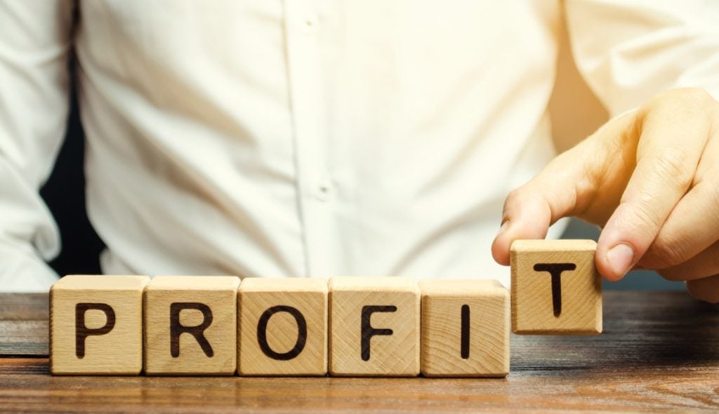 Ancillary Revenue 1 Businessman Puts Wooden Blocks With The Word Profit 1024X590 1