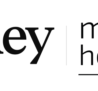 Journey | Mastel Hospitality logo with a gold globe icon