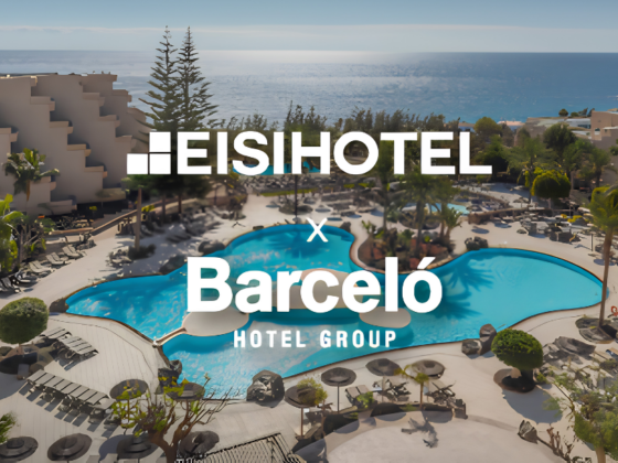 Aerial view of a seaside resort pool area with loungers, palm trees, and the ocean in the background, overlaid with HeiHotel and Barceló Hotel Group branding.