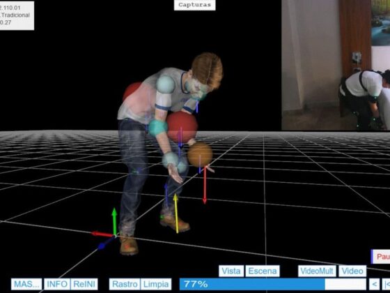 3D motion capture setup: a person bending forward with markers on joints, standing on a grid floor, with a video inset of another person in a room